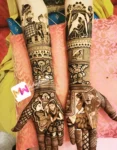 madhubani-figure-bride-groom-dolly-elephant-chhatri-flowers-with-pot-bridal-mehendi design